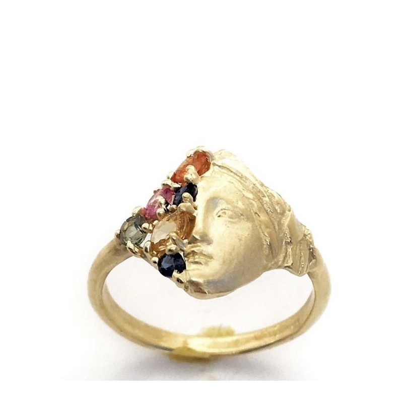 Gold and precious stone ring.