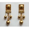Gold earrings.